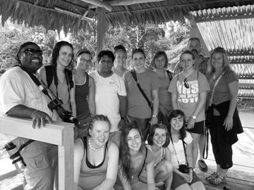 Students take a break for a photo with their guide in Peru.