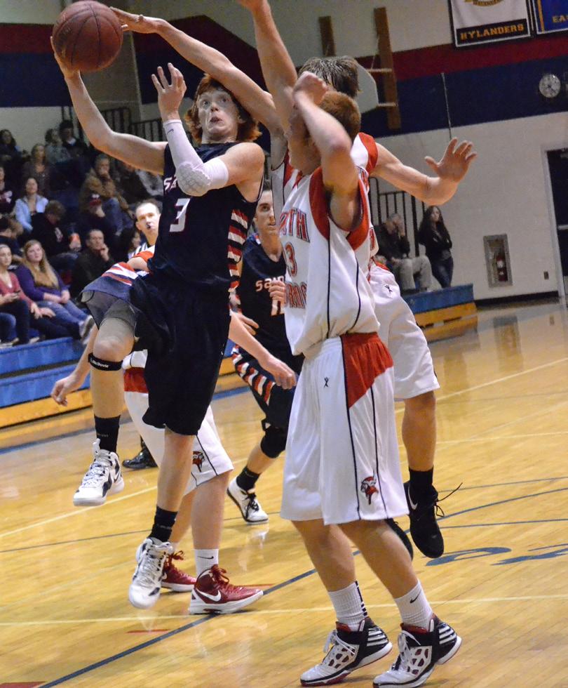 Cody Wald shoots a basket against North Branch.