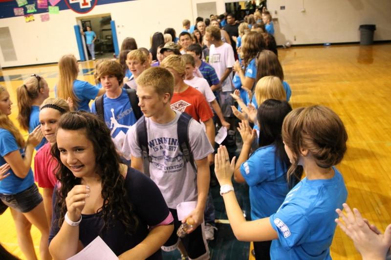 Freshmen enter the gauntlet of LINK students and Staff members to applause and high fives as they prepare for a new school year.