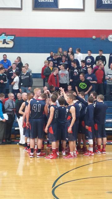 SFHS+varsity+basketball+team+huddles+up+to+cheer+before+a+game.