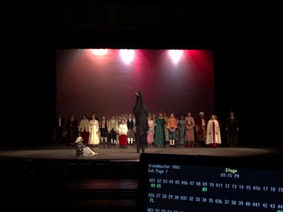 A view of the stage from the tech booth as students perform A Christmas Carol for a benefit performance for SFHS Theatre.