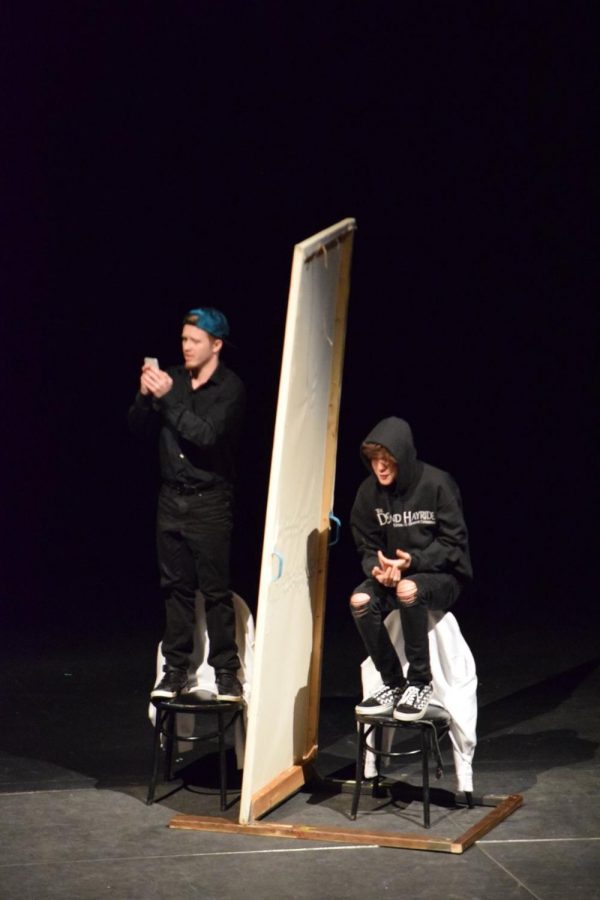 A photo from the 2019 competition one act play Declaration by Jonathon Dorf. Pictured: Actors Austin Adler and Jacob Ferguson portray students who are stuck in the bathroom during a school shooting incident.