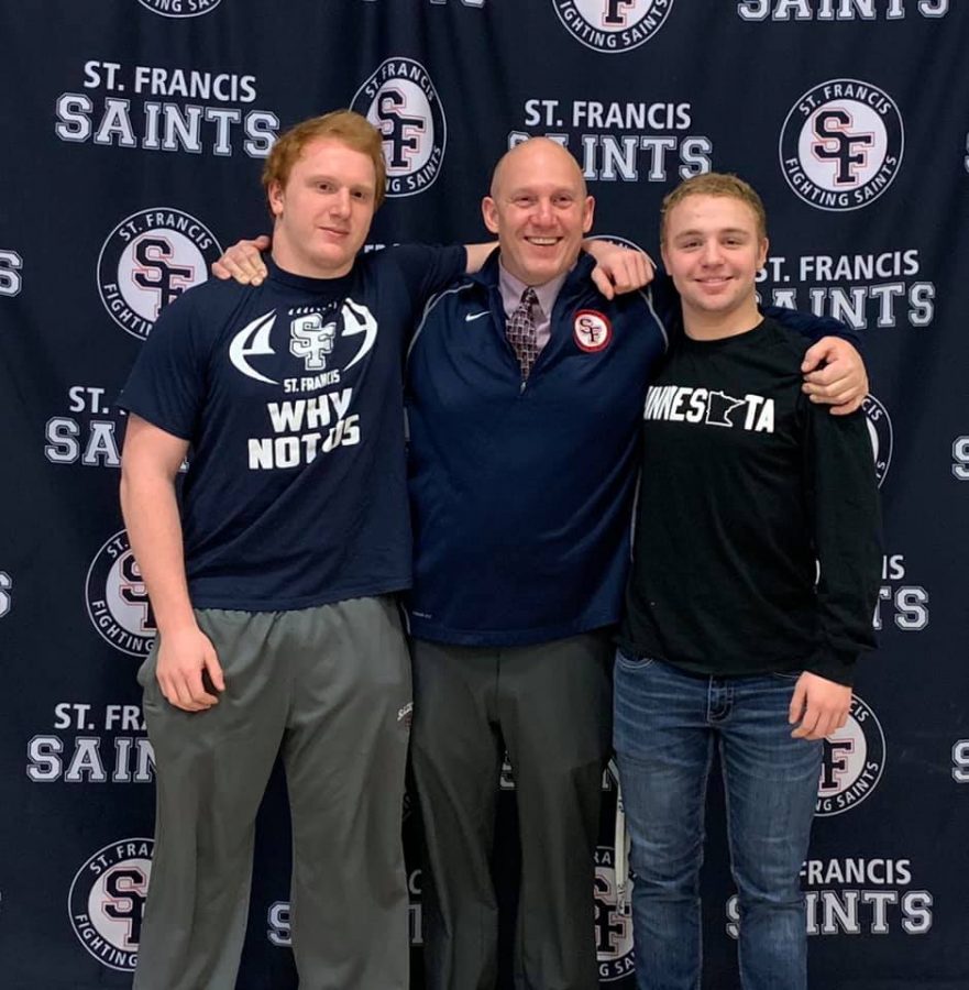 Activities Director Chris Lindquist poses with state-bound wrestlers Kyle Lindenfelser and Joey Lipinski.