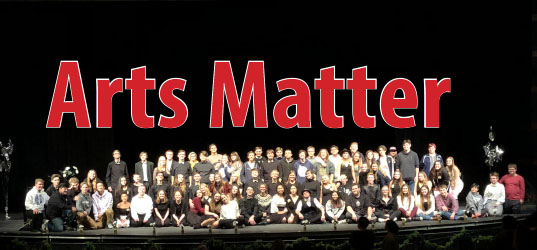 Pictured: Students took to the stage in the PAC to rally for support for the Arts in St. Francis Area Schools.