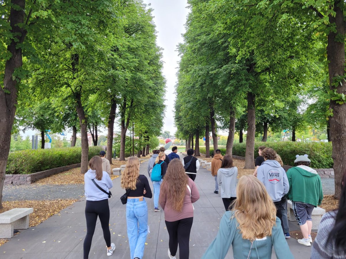 Sculpture students walking into the Walker Sculpture Garden for field trip